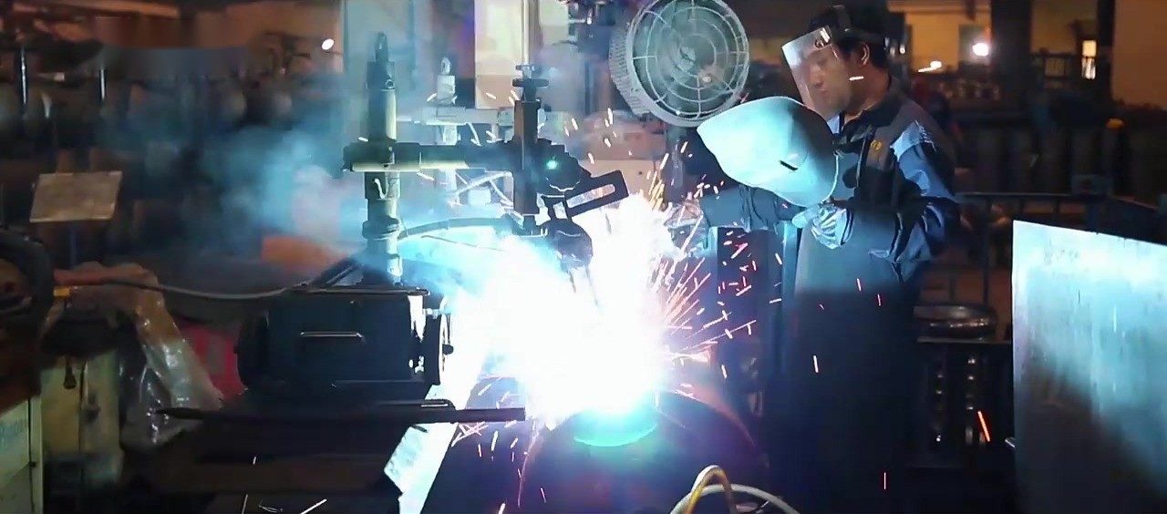 Welder working on a pressure-vessel component